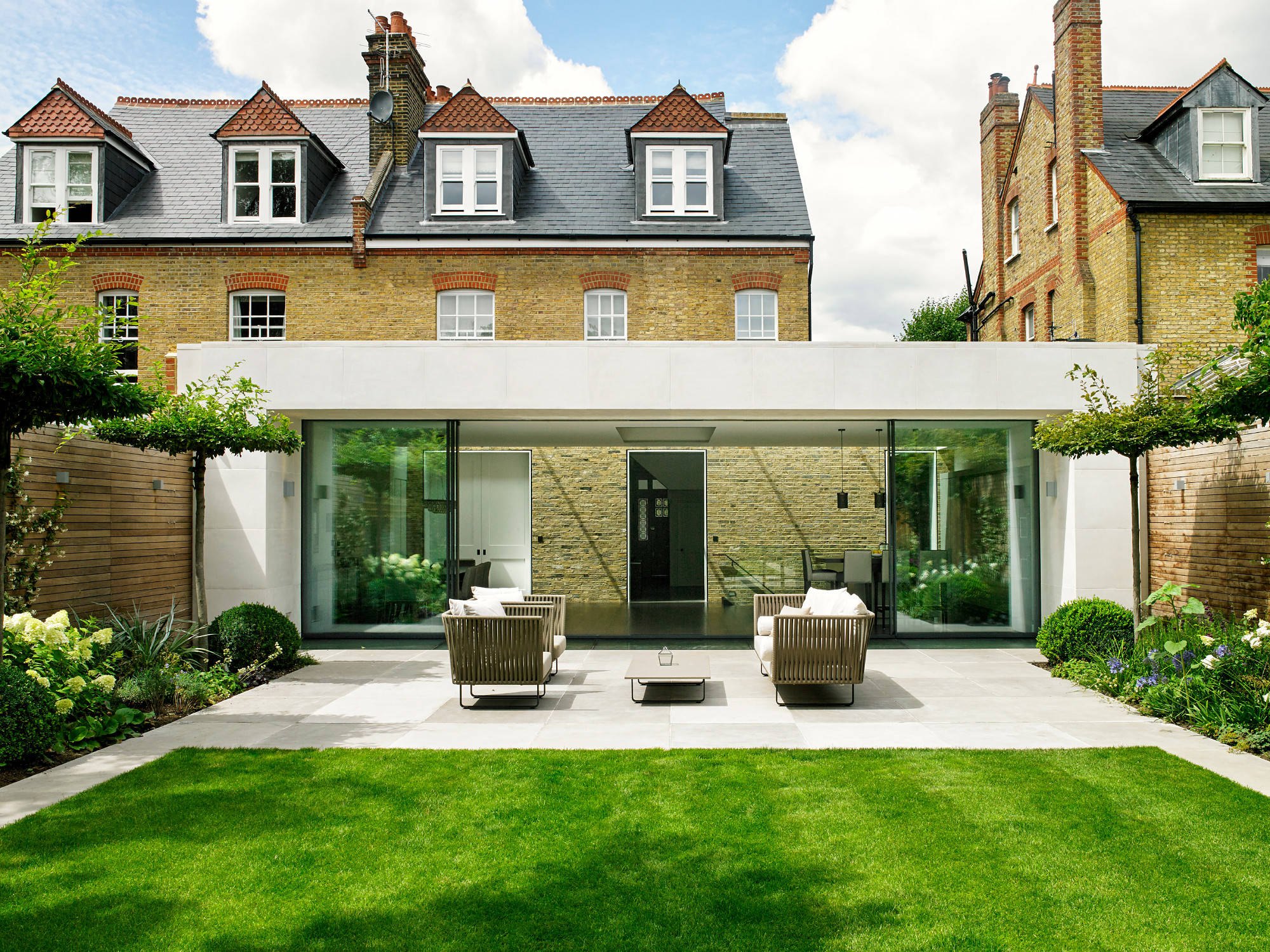 A finished house elevation in brick and glazing